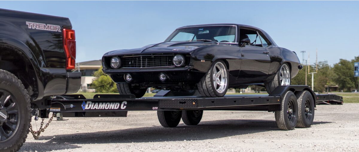 Classic car being transported on a trailer